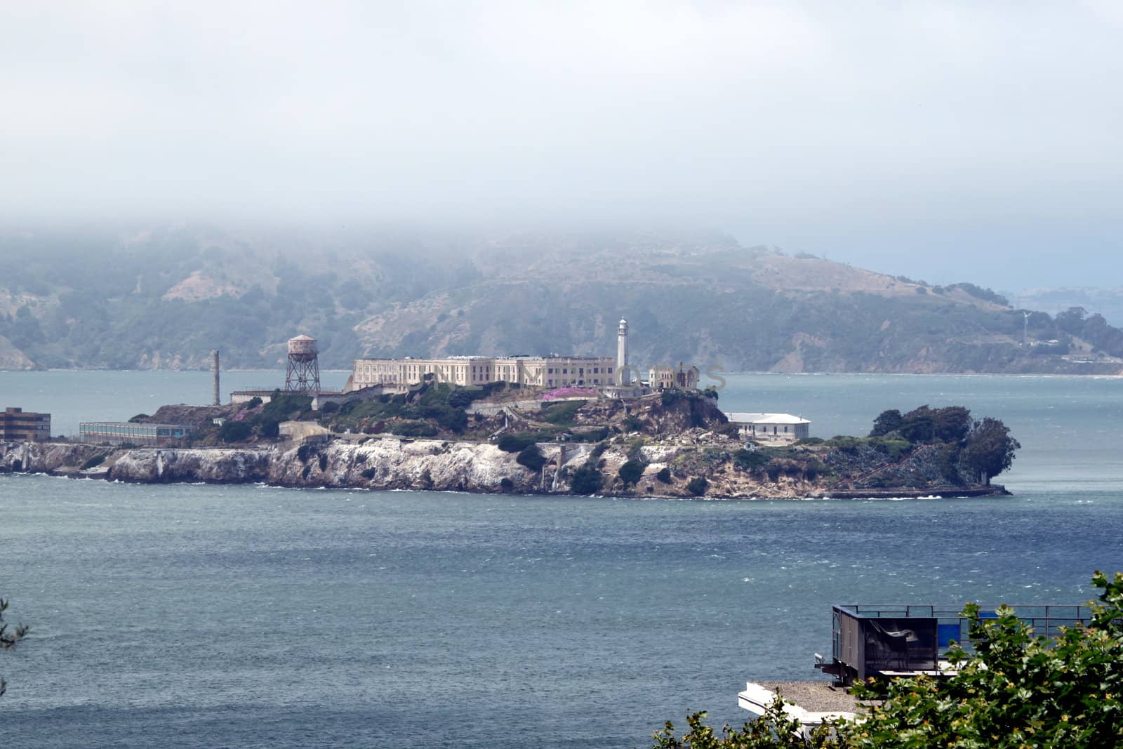 The prison island Alcatraz with a fog bank over it.