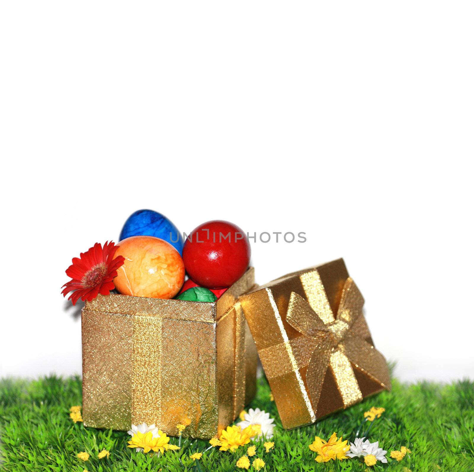 Easter eggs in a gold gift box by photochecker