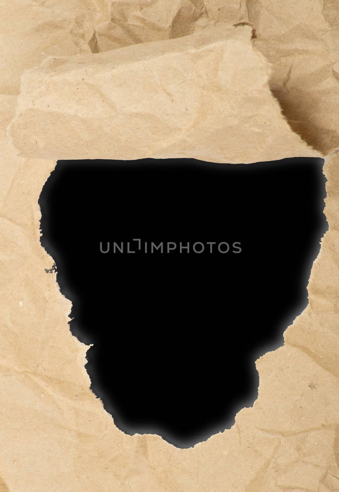 ripped white paper against a black background