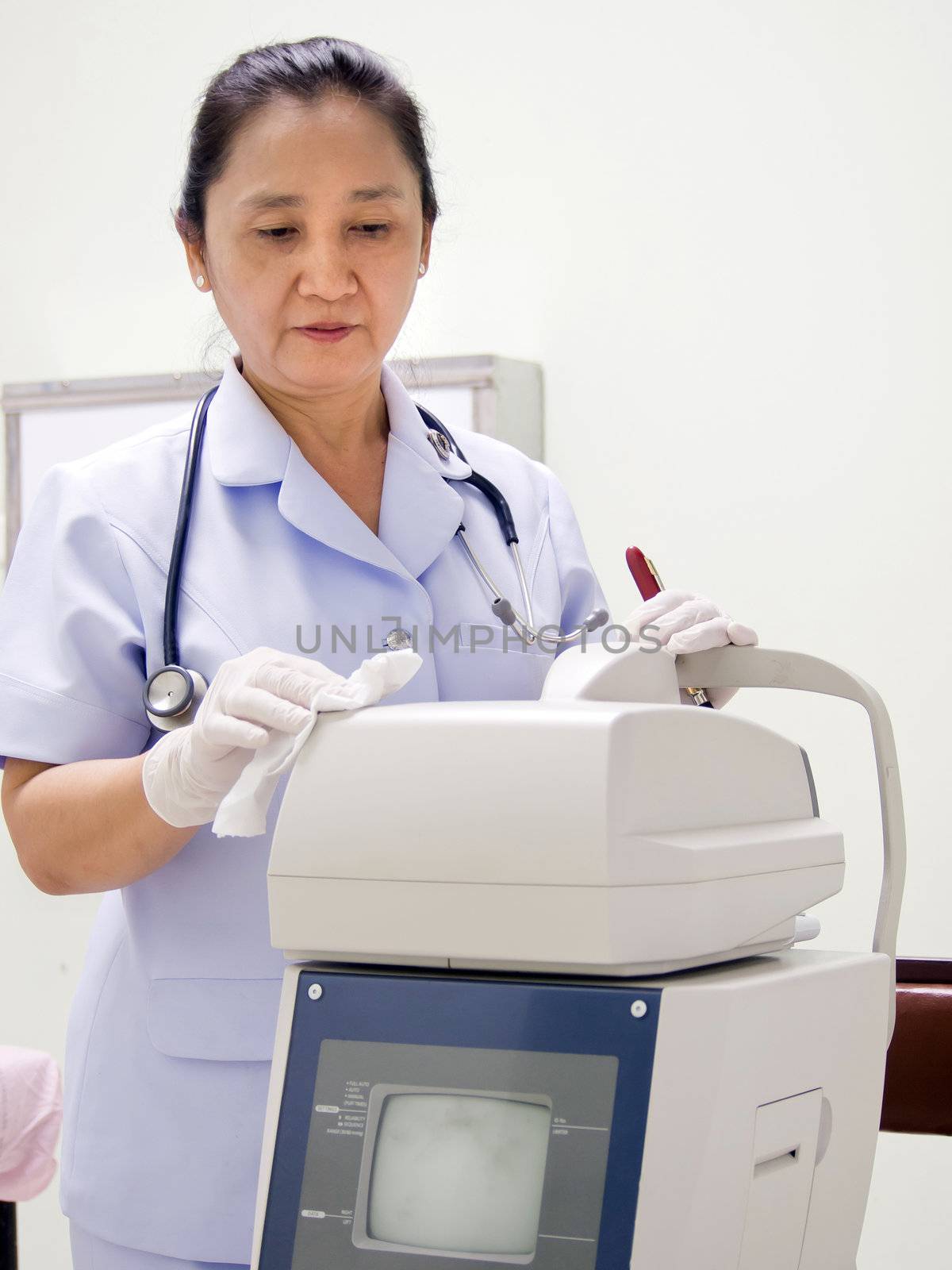 Nurse Cleaning Hospital Equipment; Computerized Optometer