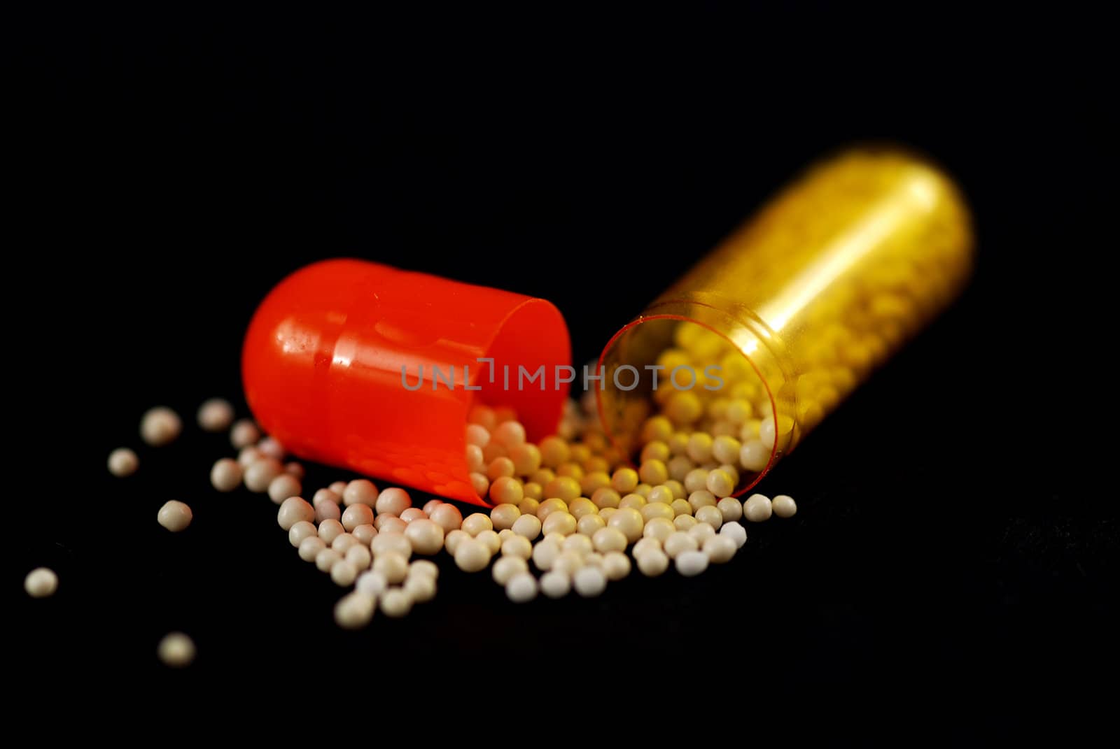 pictures of capsule pills showing the medicine inside it