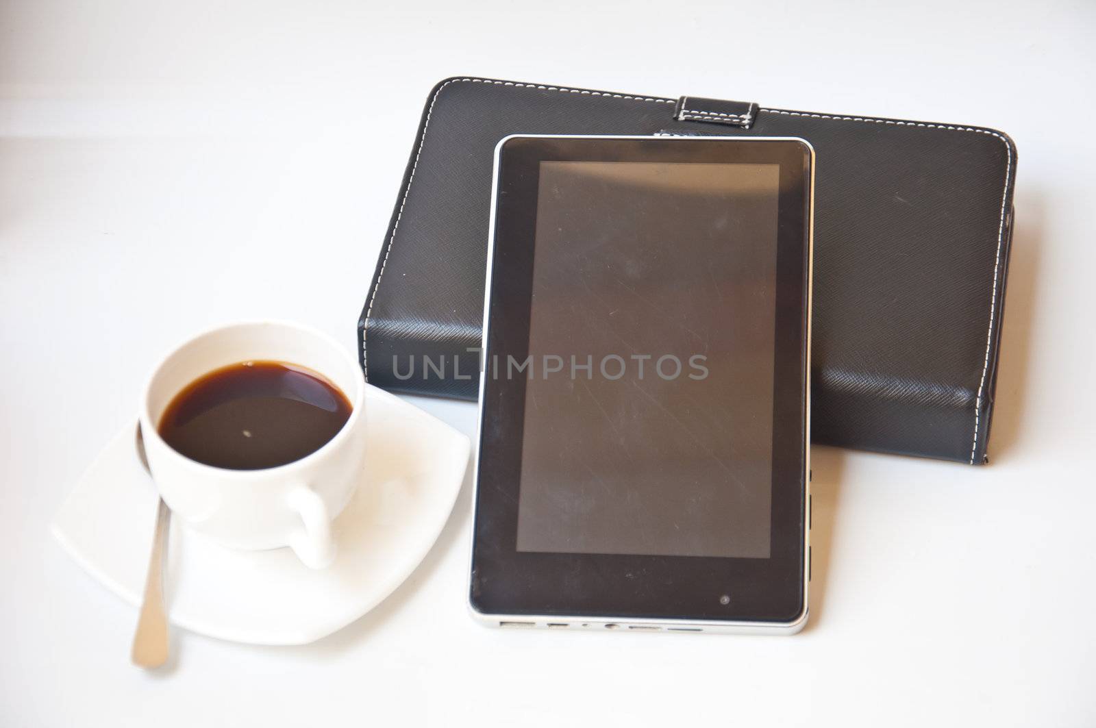 black coffee and tablet PC on white background