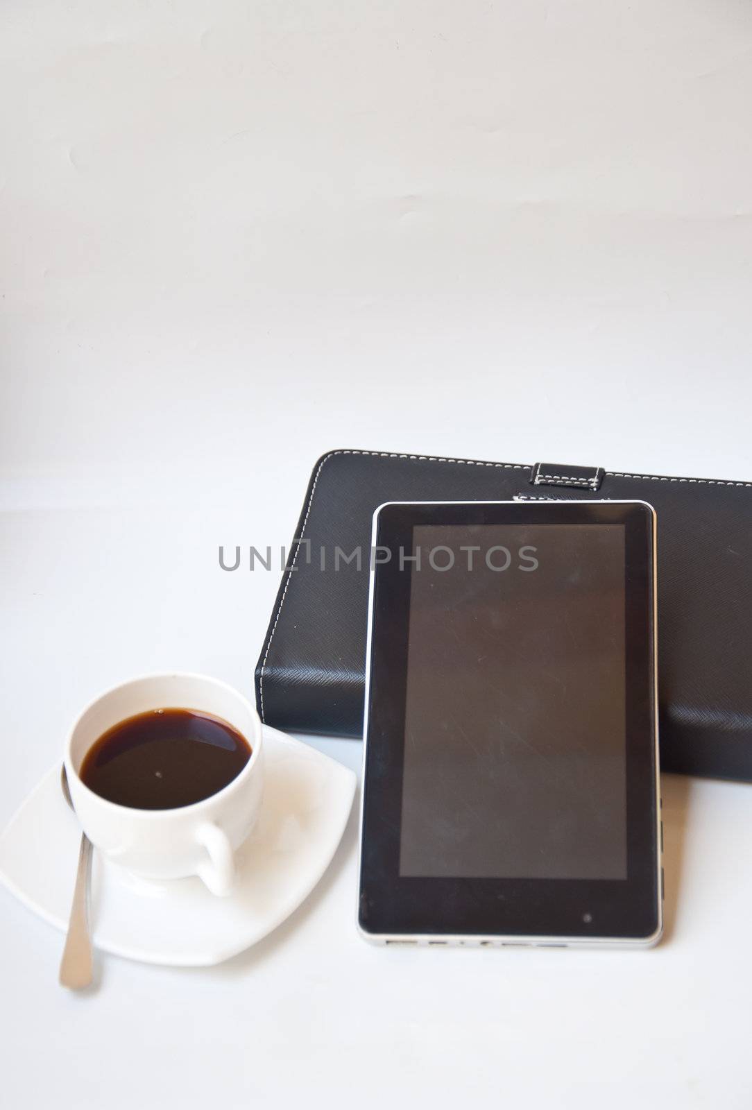 Black coffee and tablet PC by buffaloboy