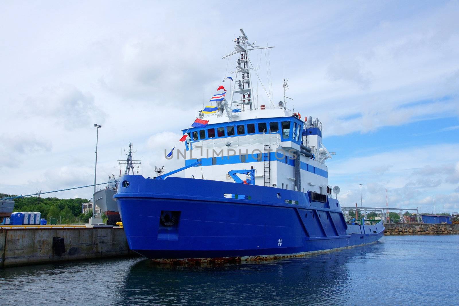 The salvage ship costs in port at a mooring