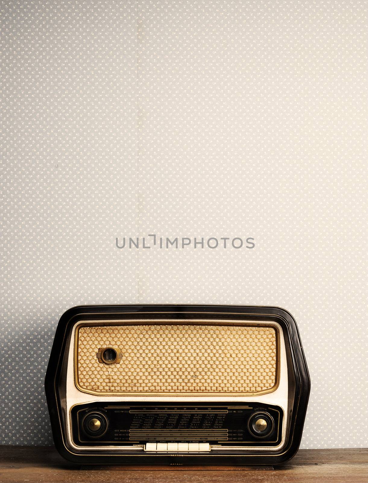 antique radio on vintage background by stokkete