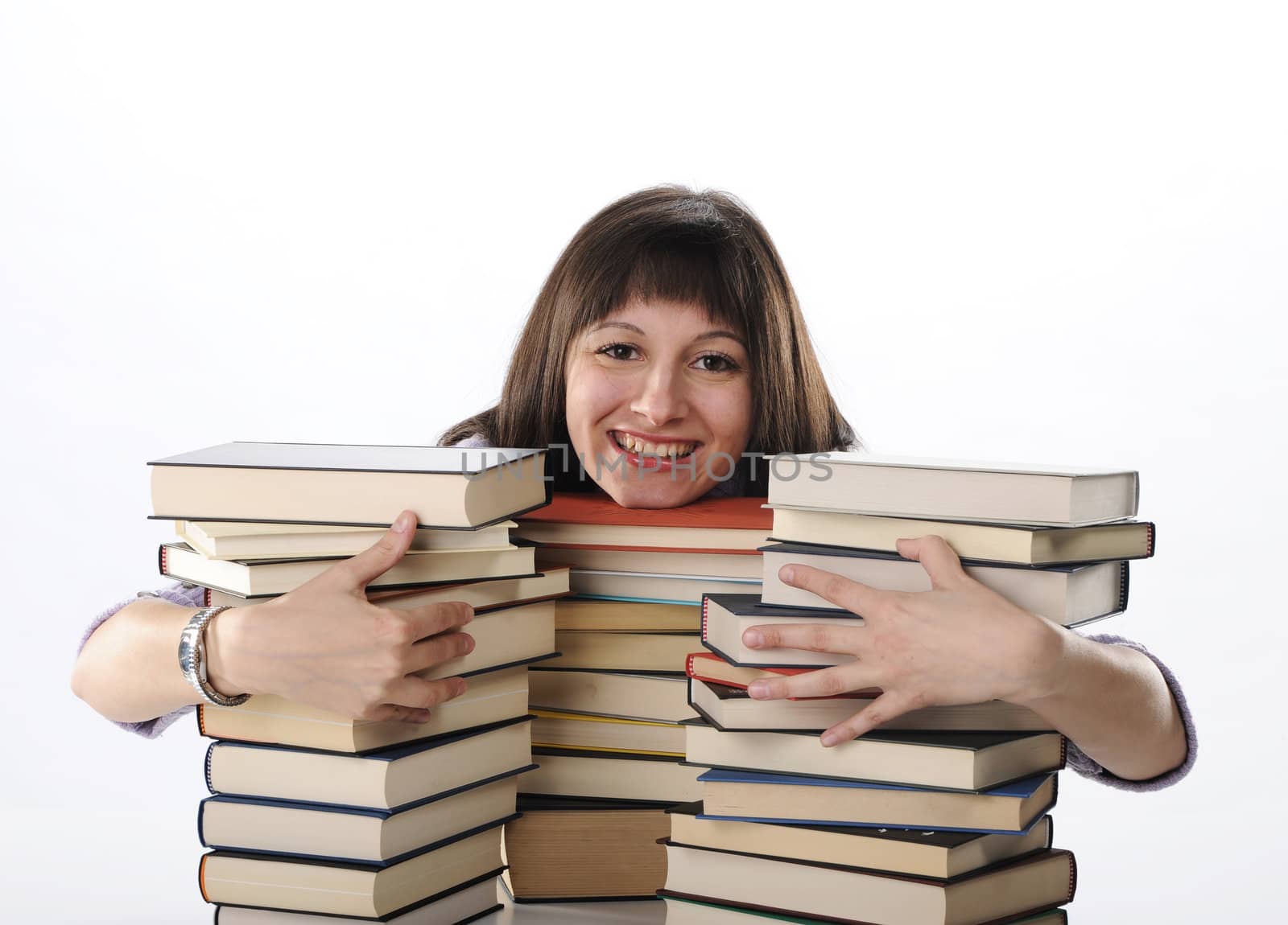 young woman behind a big pile of books  by stokkete