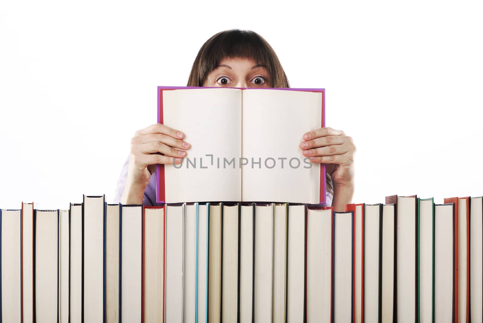 young Woman holding an open book . Pages are blank by stokkete