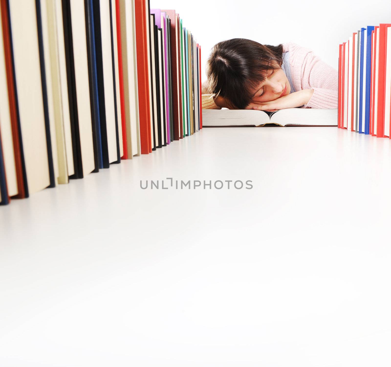 student fell asleep  while doing his homework. similar pictures  by stokkete