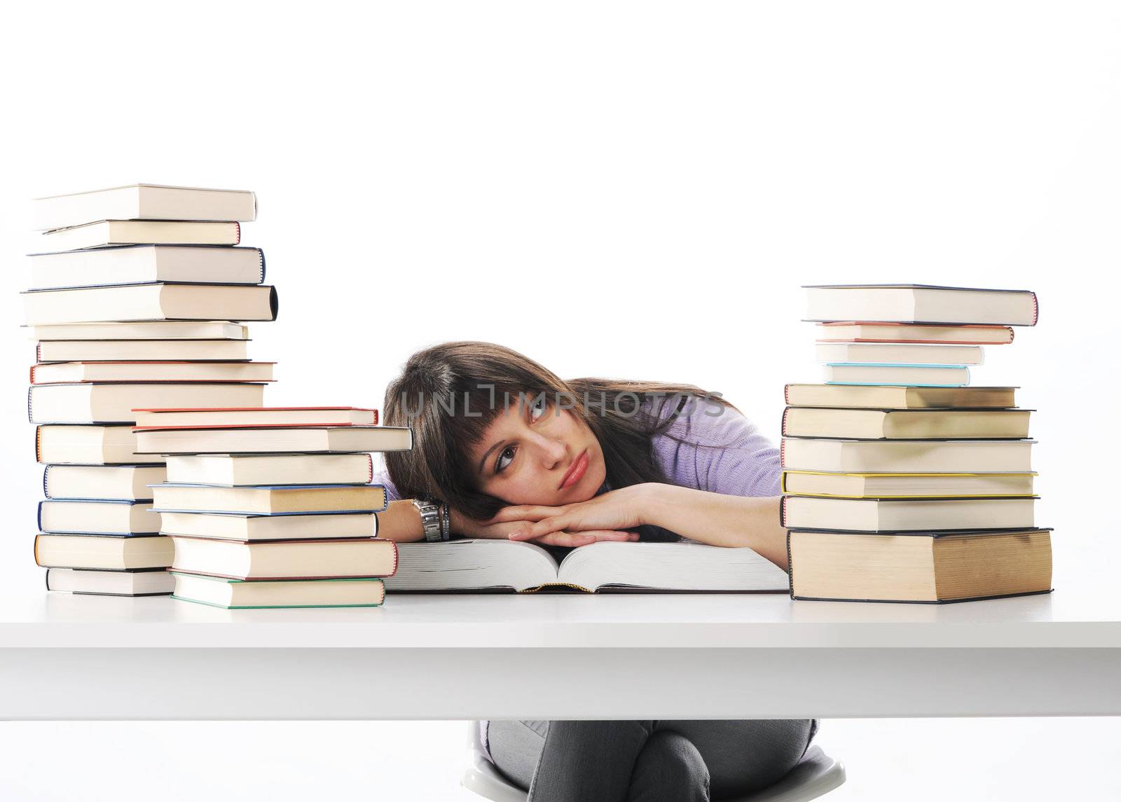 Tired of studies, young Woman on her desk with books, similar pi by stokkete