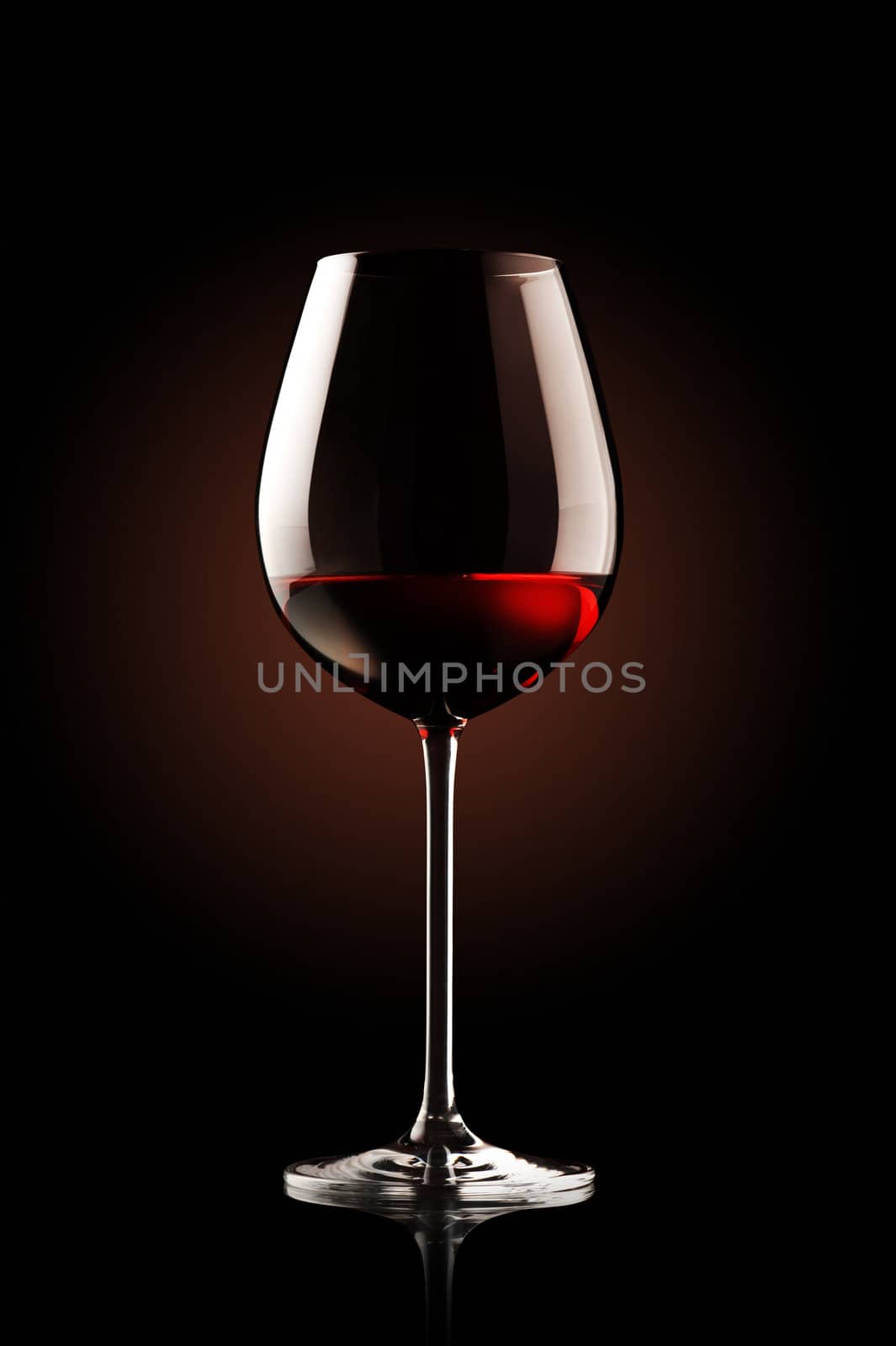 re wine glass on black background
