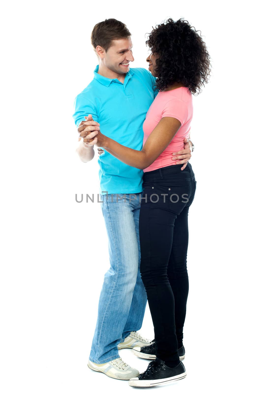 Full length portrait of adorable dancing couple enjoying themselves and getting romantic