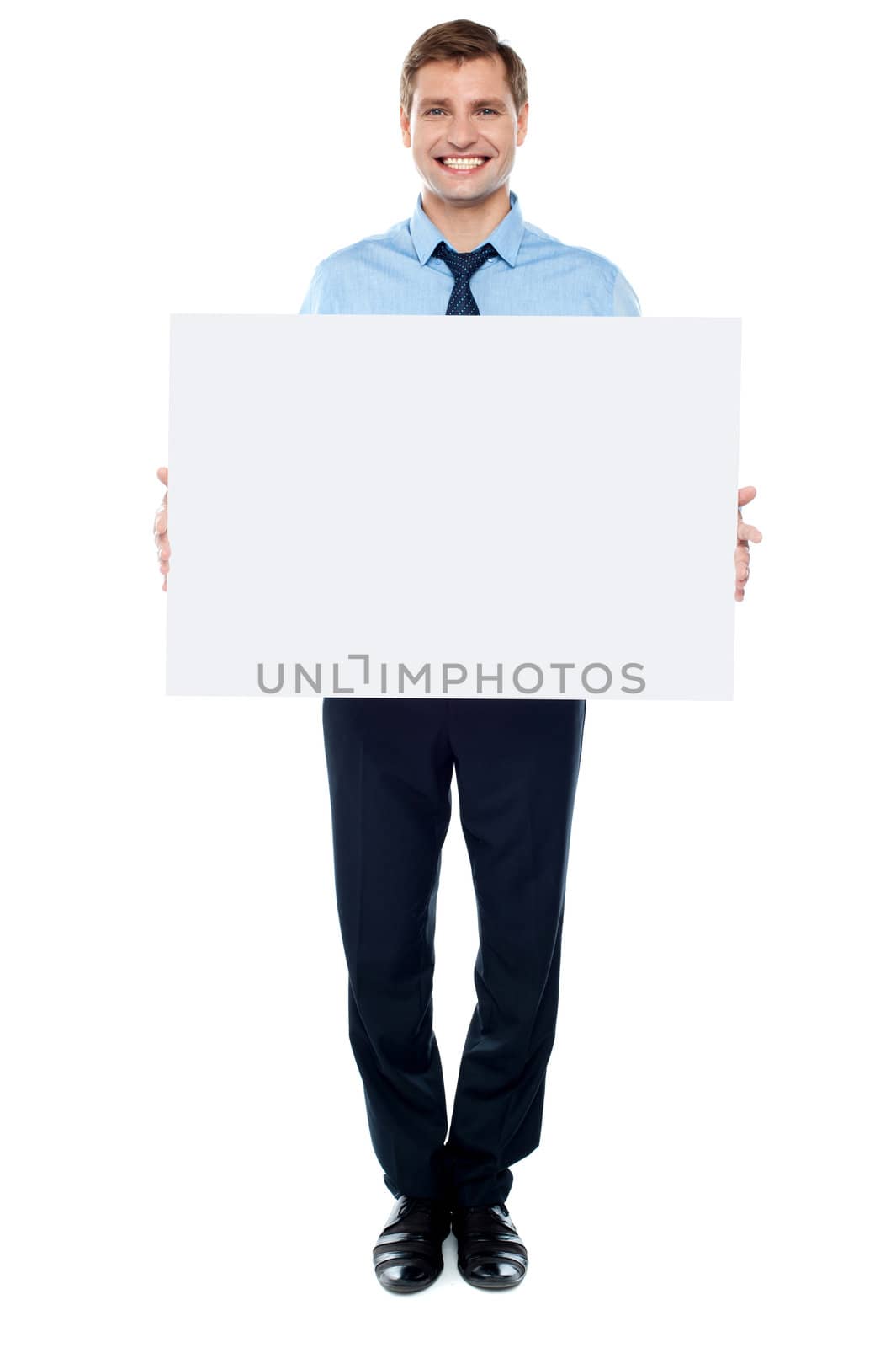 Businessman holding blank white billboard, full length portrait