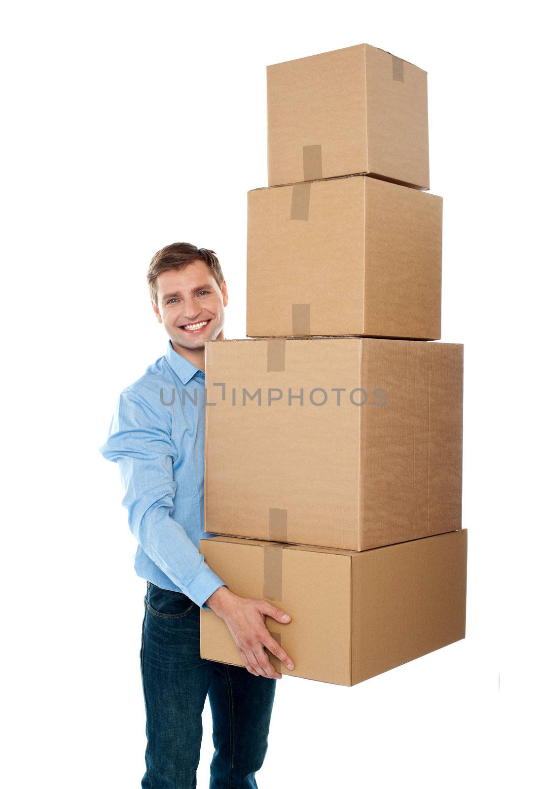 Handsome male with with stack of boxes isolated on white
