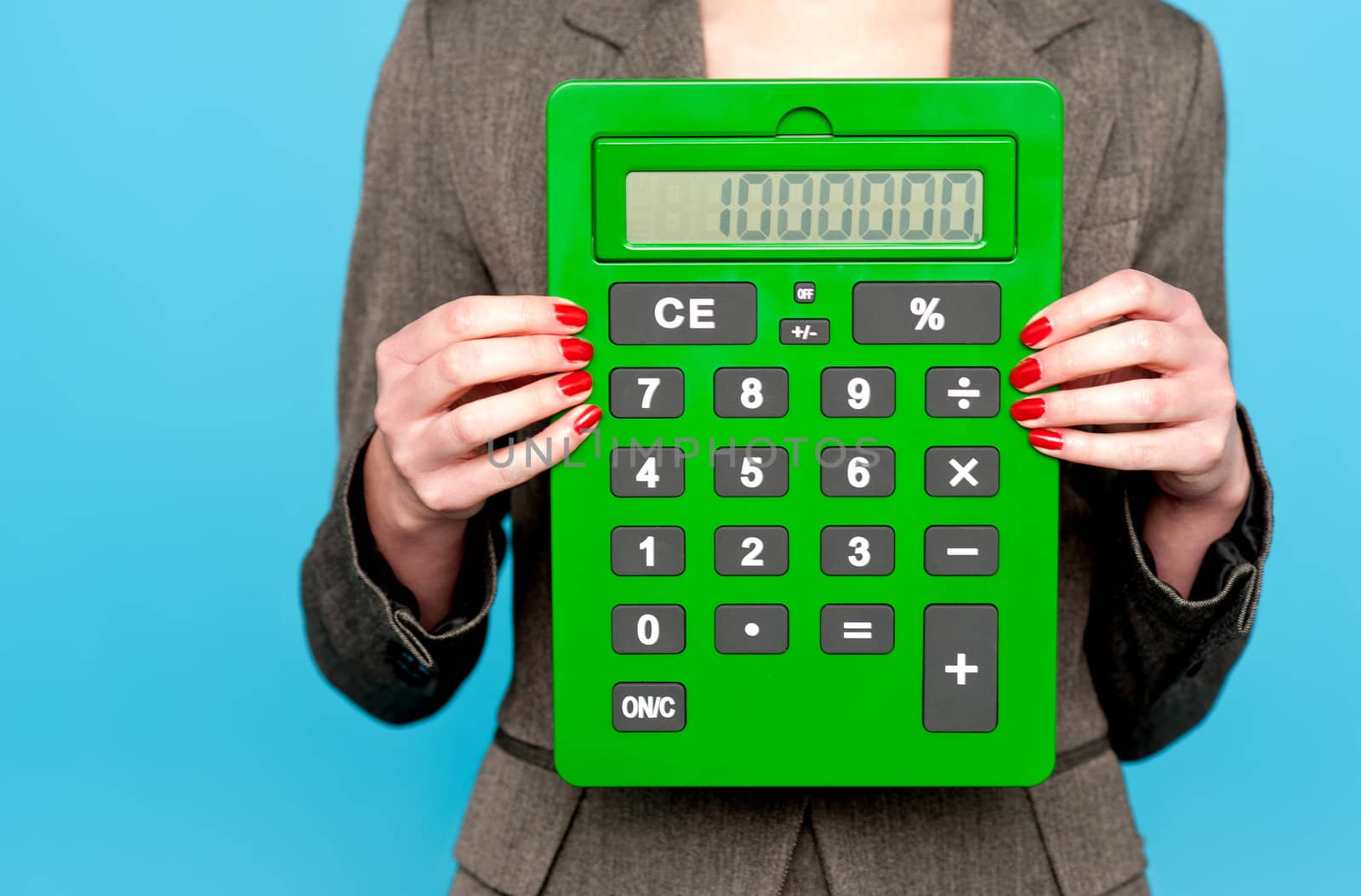 Hands of a businesswoman showing calculator to camera. Cropped image