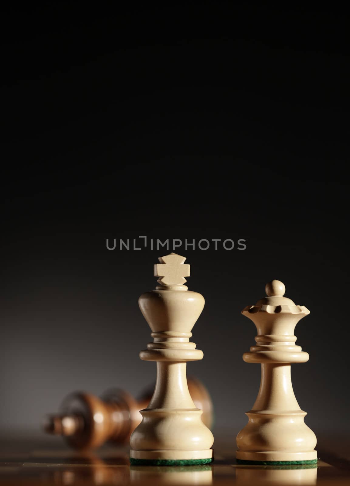 king and queen chess pieces. Low depth of field, focus on foreground.