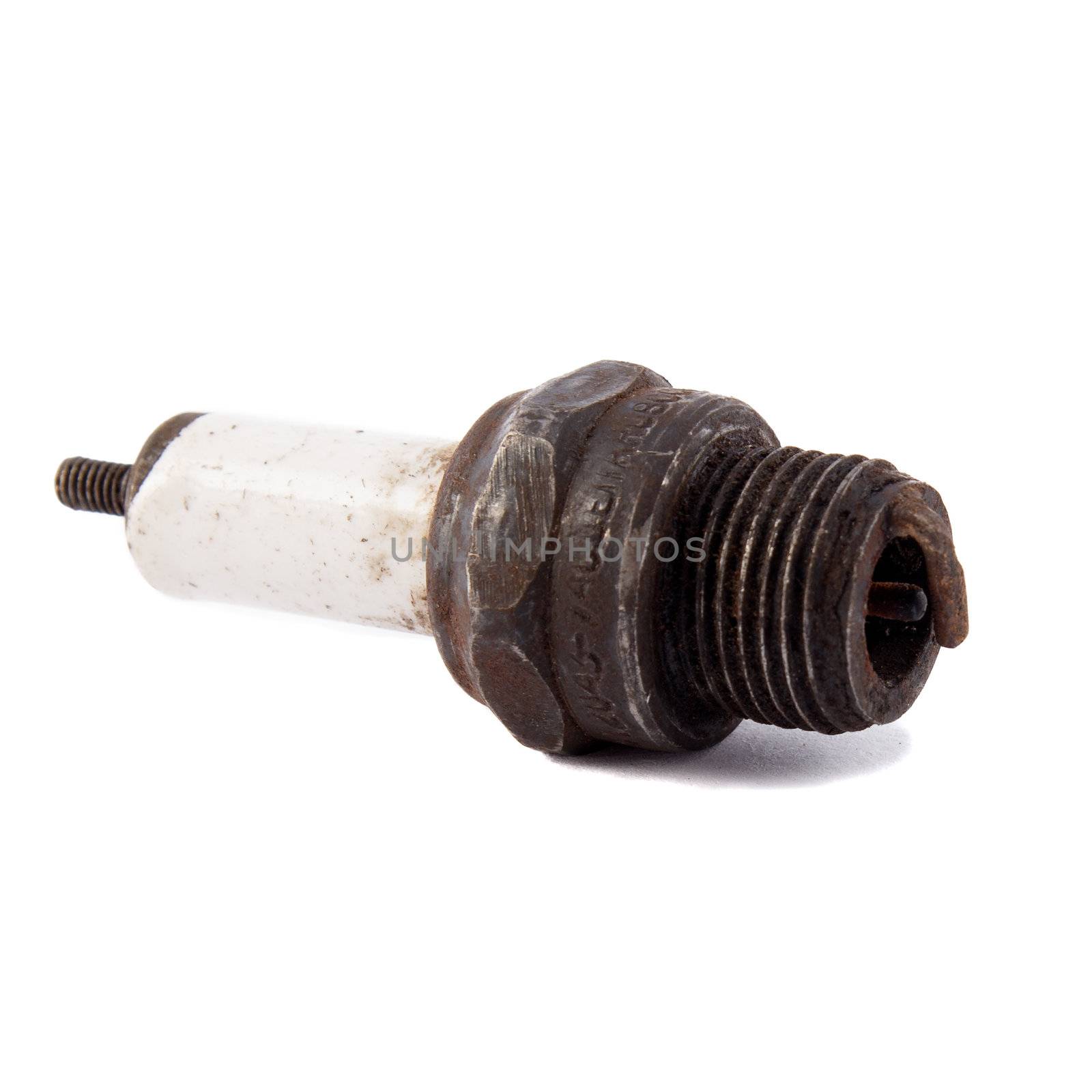 old used car spark plug on a white background