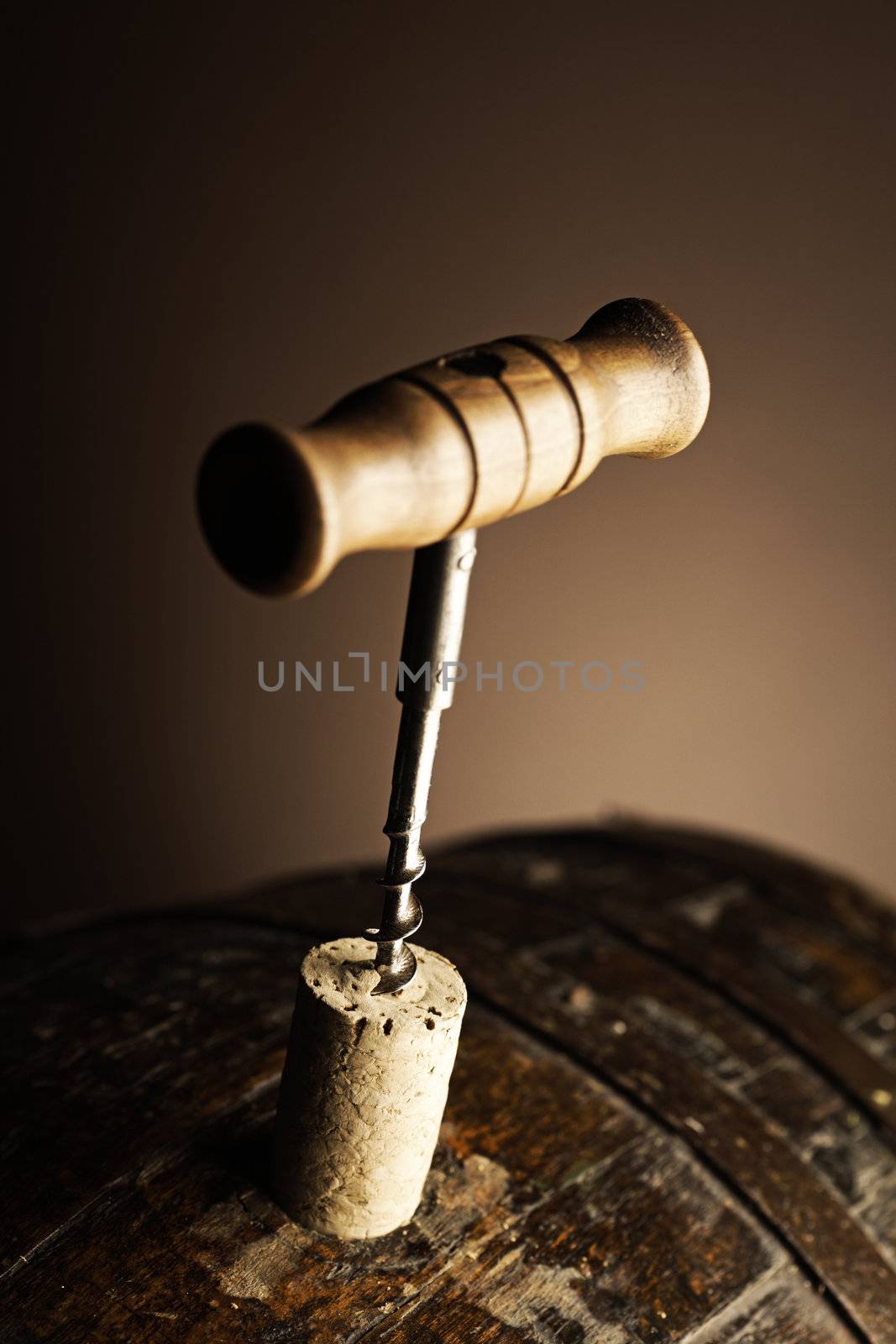 corkscrew and wooden barrel