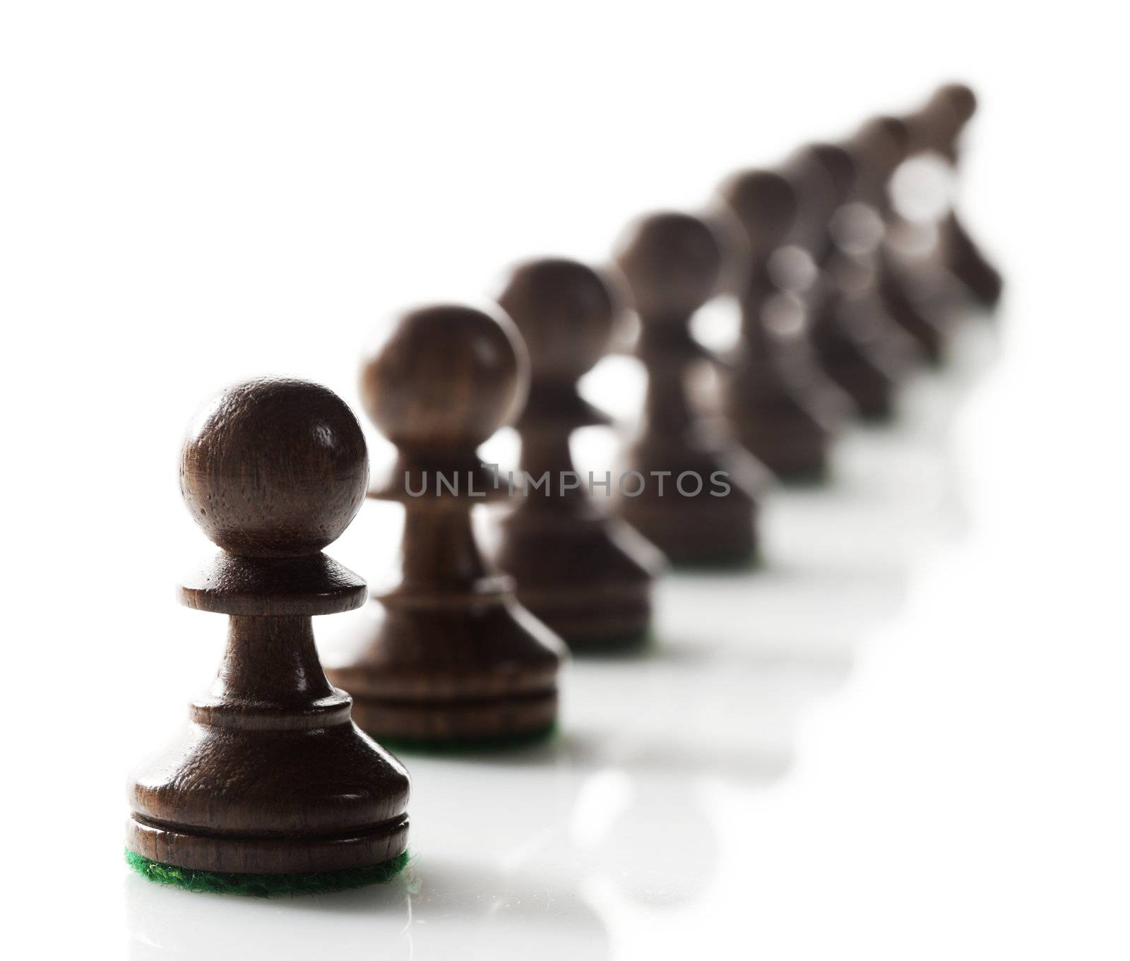 pawns chess pieces ready to do battle. by stokkete