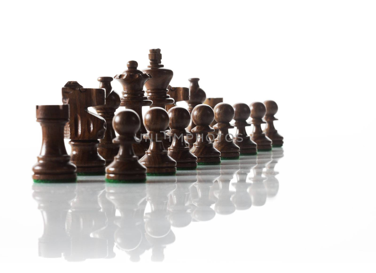 Chess pieces ready to do battle. by stokkete