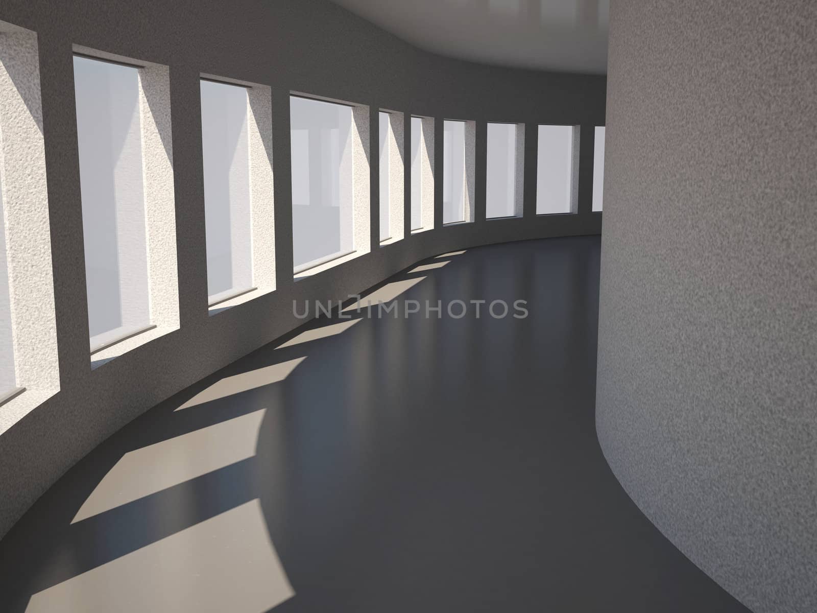 A long gray corridor with big windows