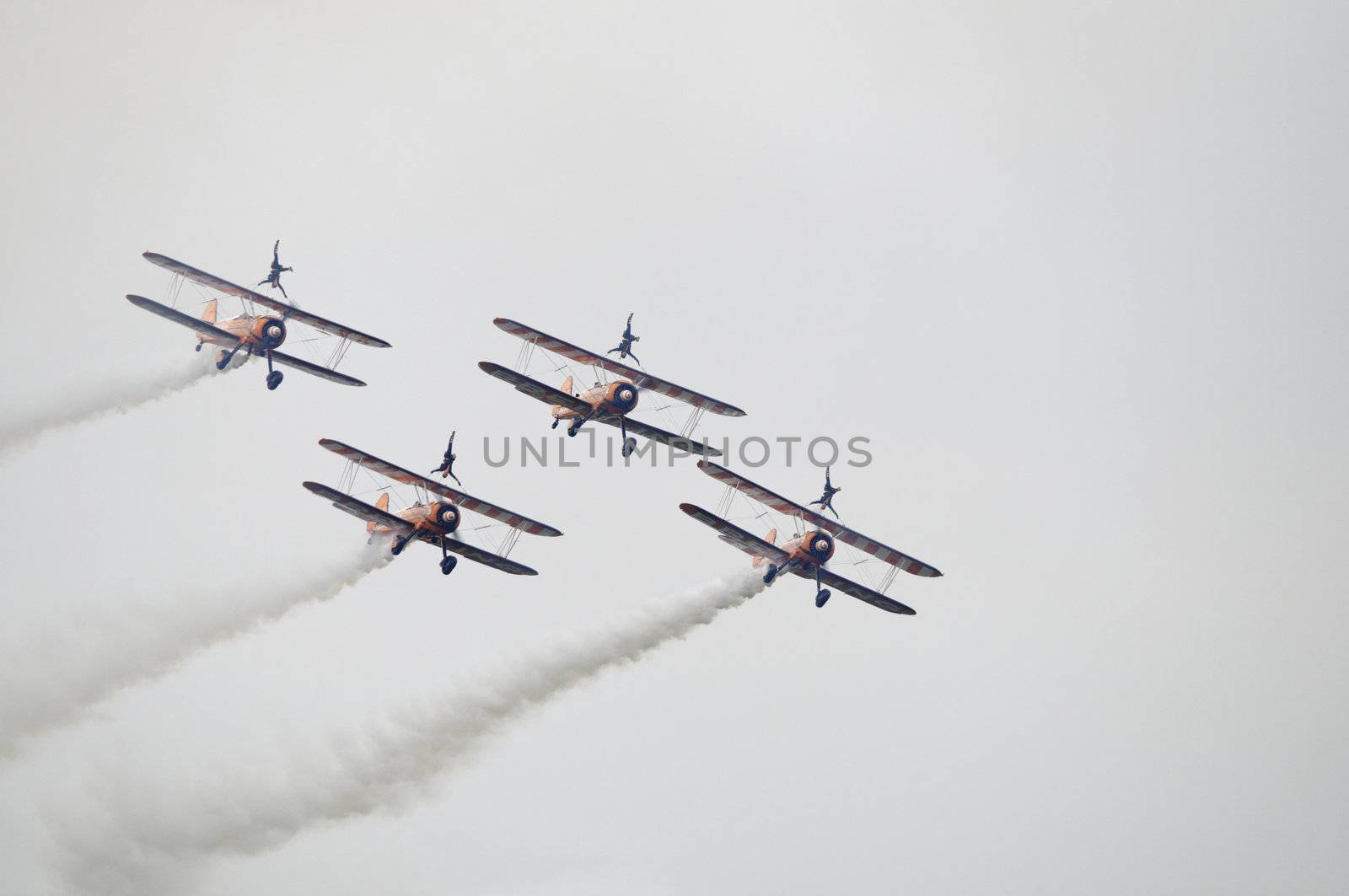 LONDON, UK, Saturday July 14, 2012. The Breitling Wingwalkers displaying at Farnborough International Airshow 2012. The Breitling Wingwalkers fly on Boeing-Stearman Model 75.