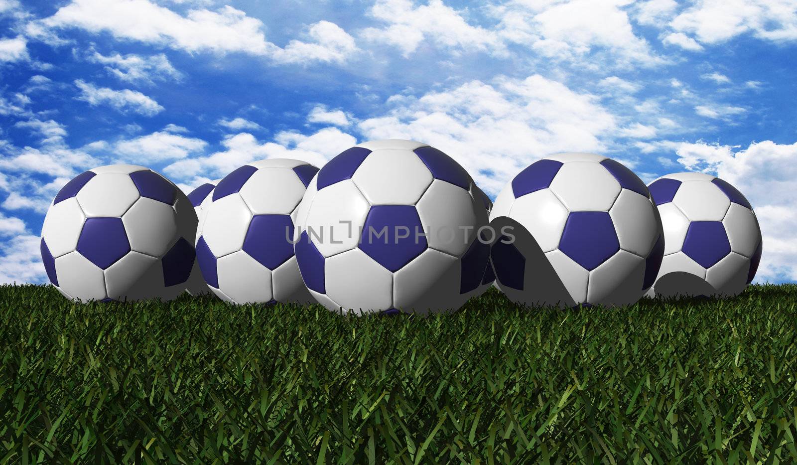 Blue soccer balls on a green grass - outdoors