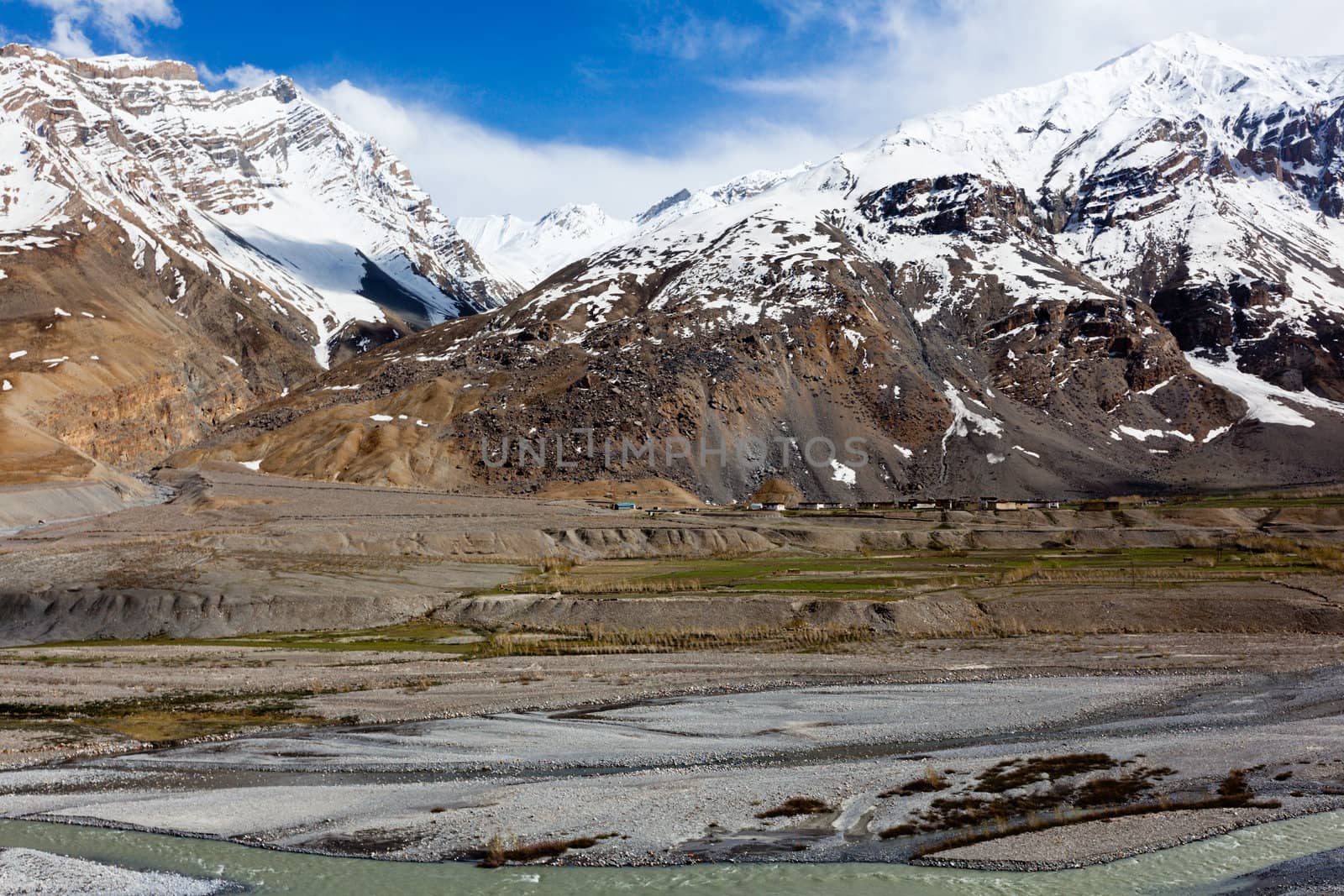 Spiti Valley - village and snowcapped Himalayan Mountains. Himachal Pradesh, India