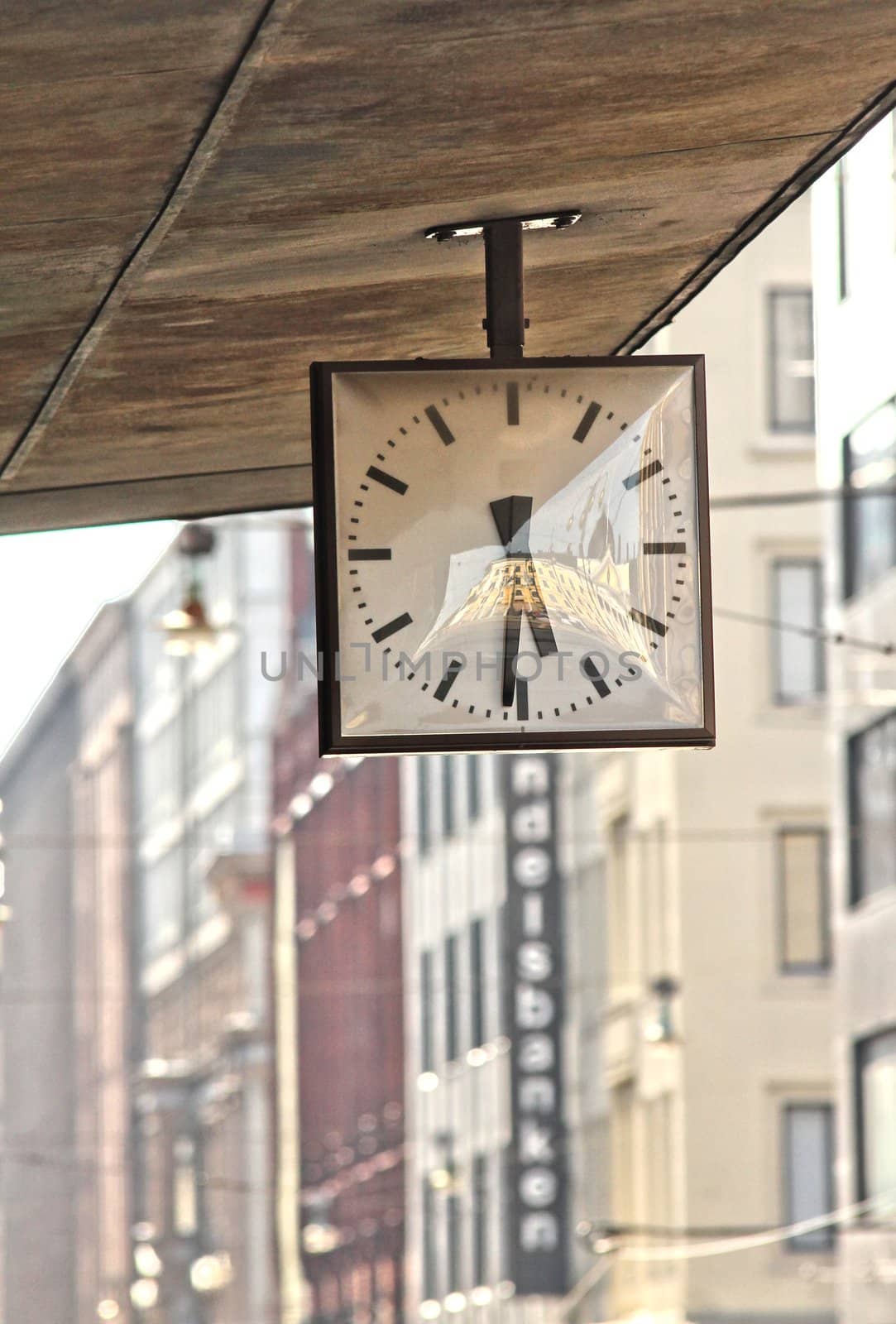 Street clock. Hanging clock on city walk. by Arvebettum