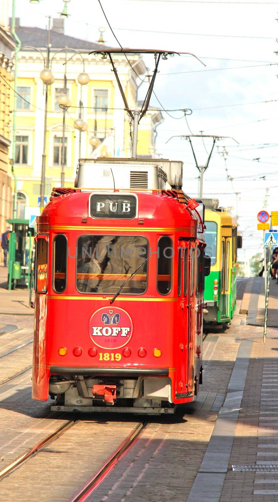 Red pub tram in the capital of Finland, Helsinki by Arvebettum