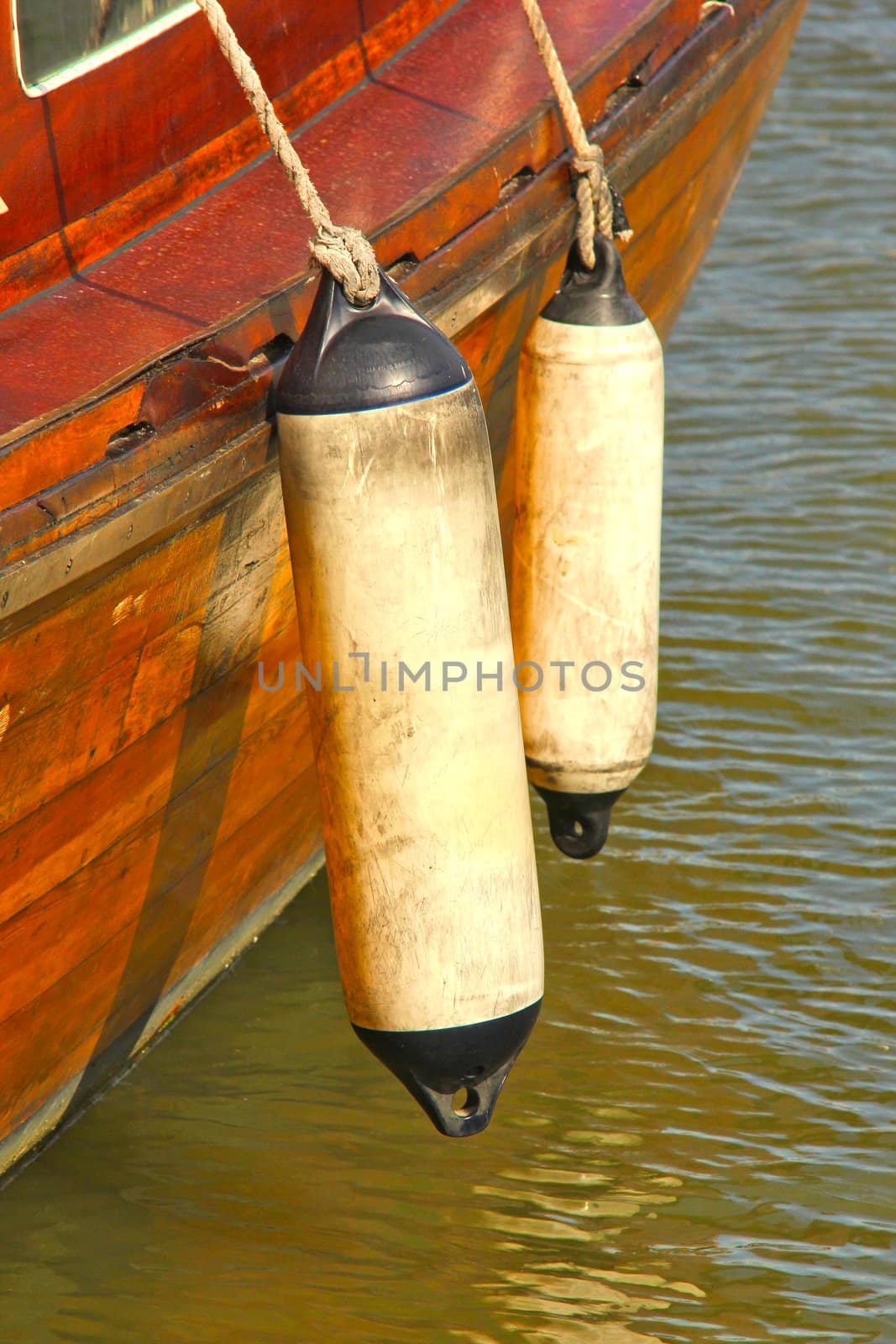 Side view of a wooden vintage boat in the harbor