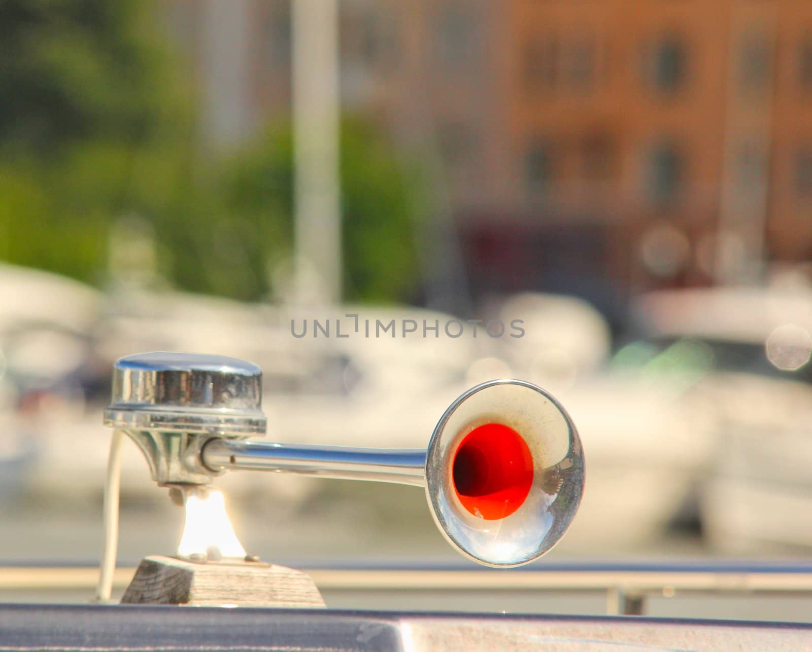 Fog horn mounted onto a boat, in harbor