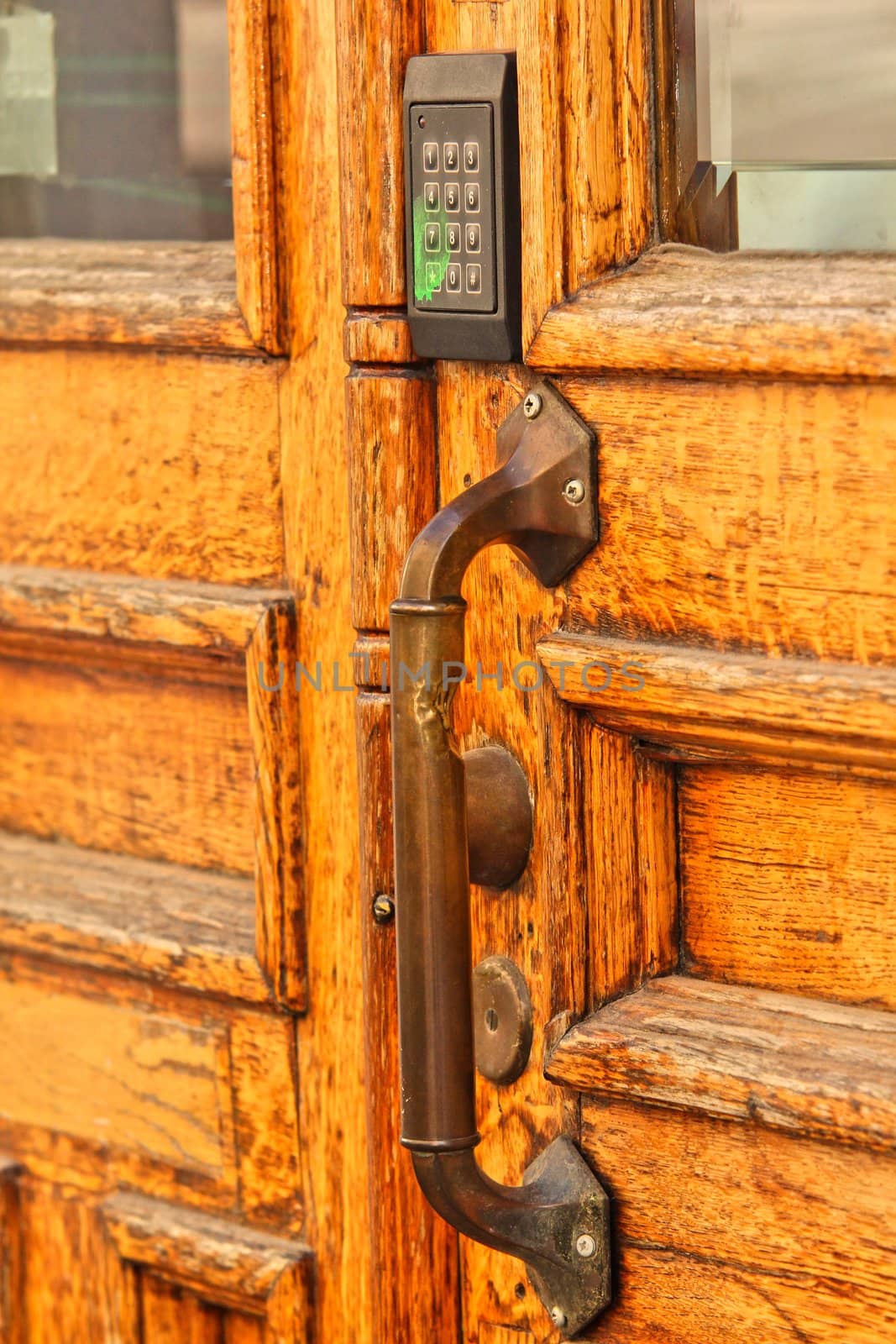 Old wooden door, with modern code opener by Arvebettum