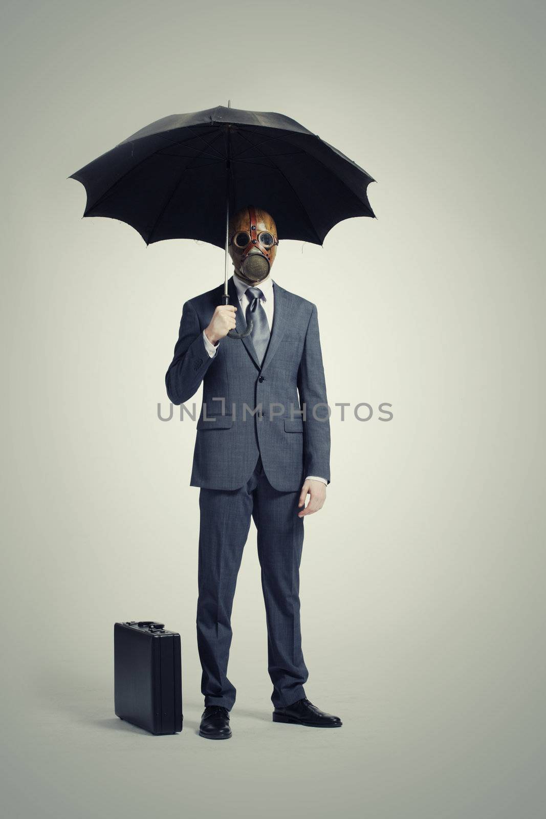 business man with umbrella by stokkete