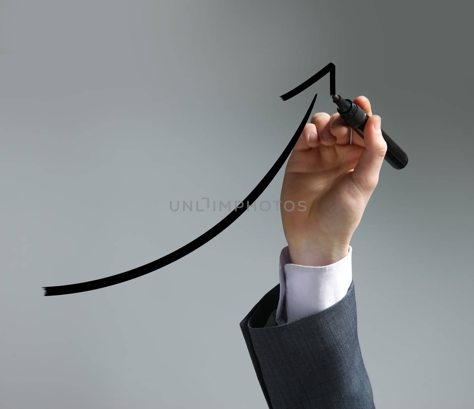 Businessman drawing a uptrend chart on screen by stokkete