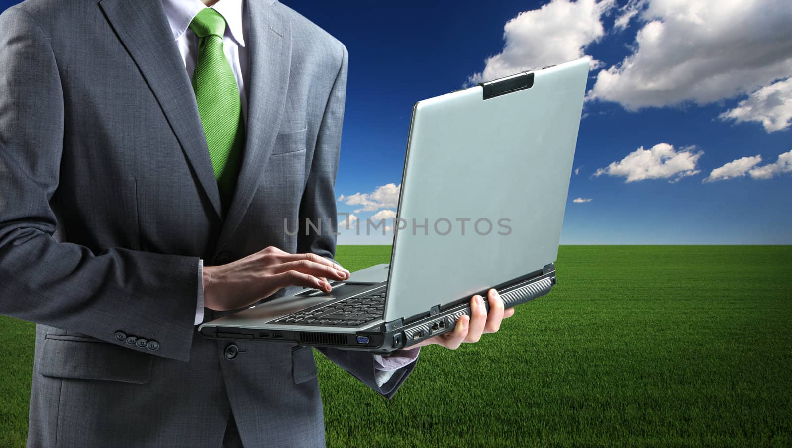 Businessman with Laptop by stokkete