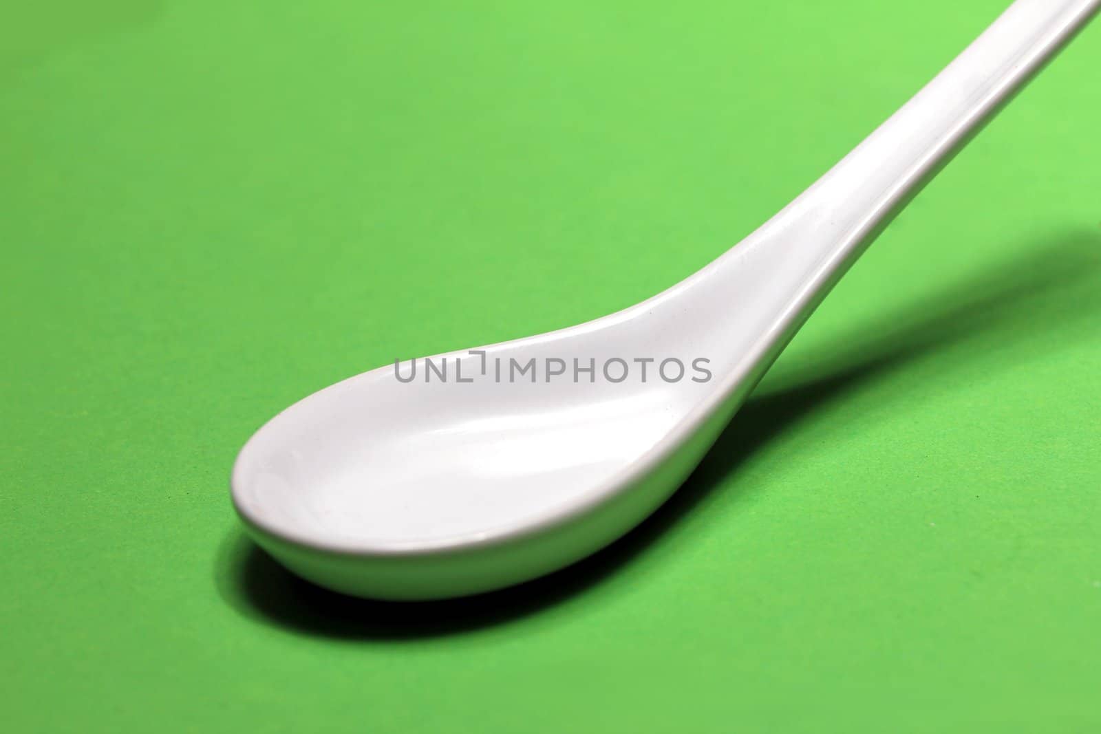 plain white porcelain spoon