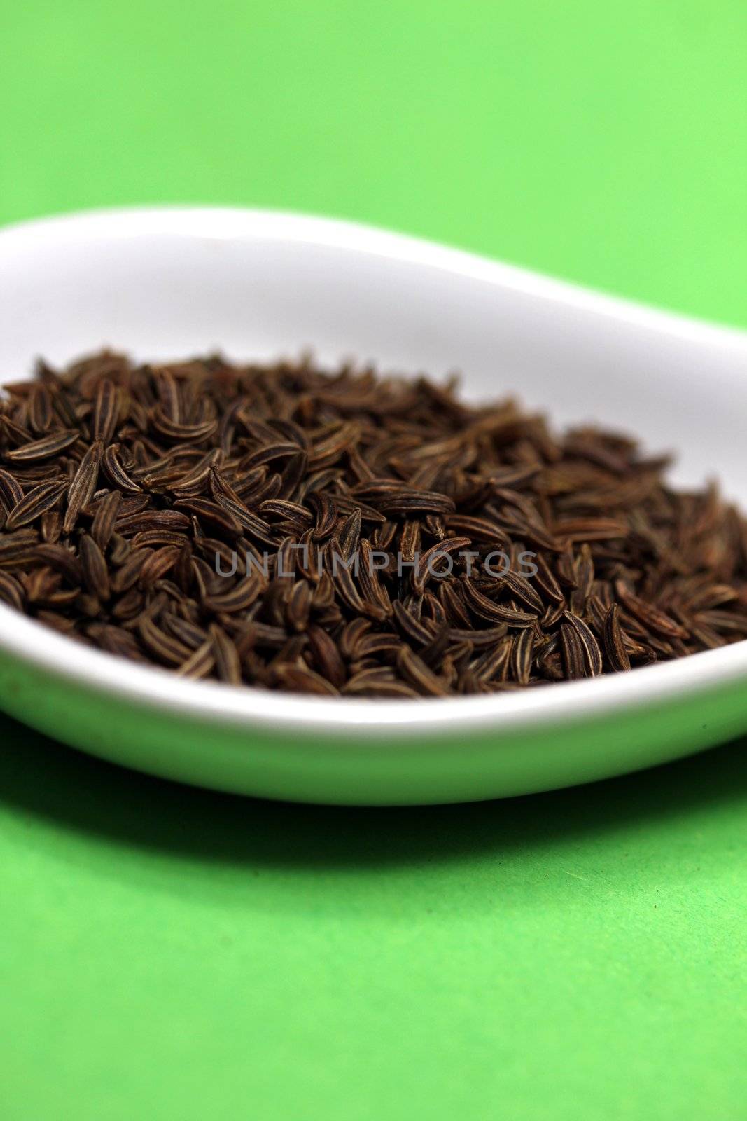 caraway on a porcelain spoon