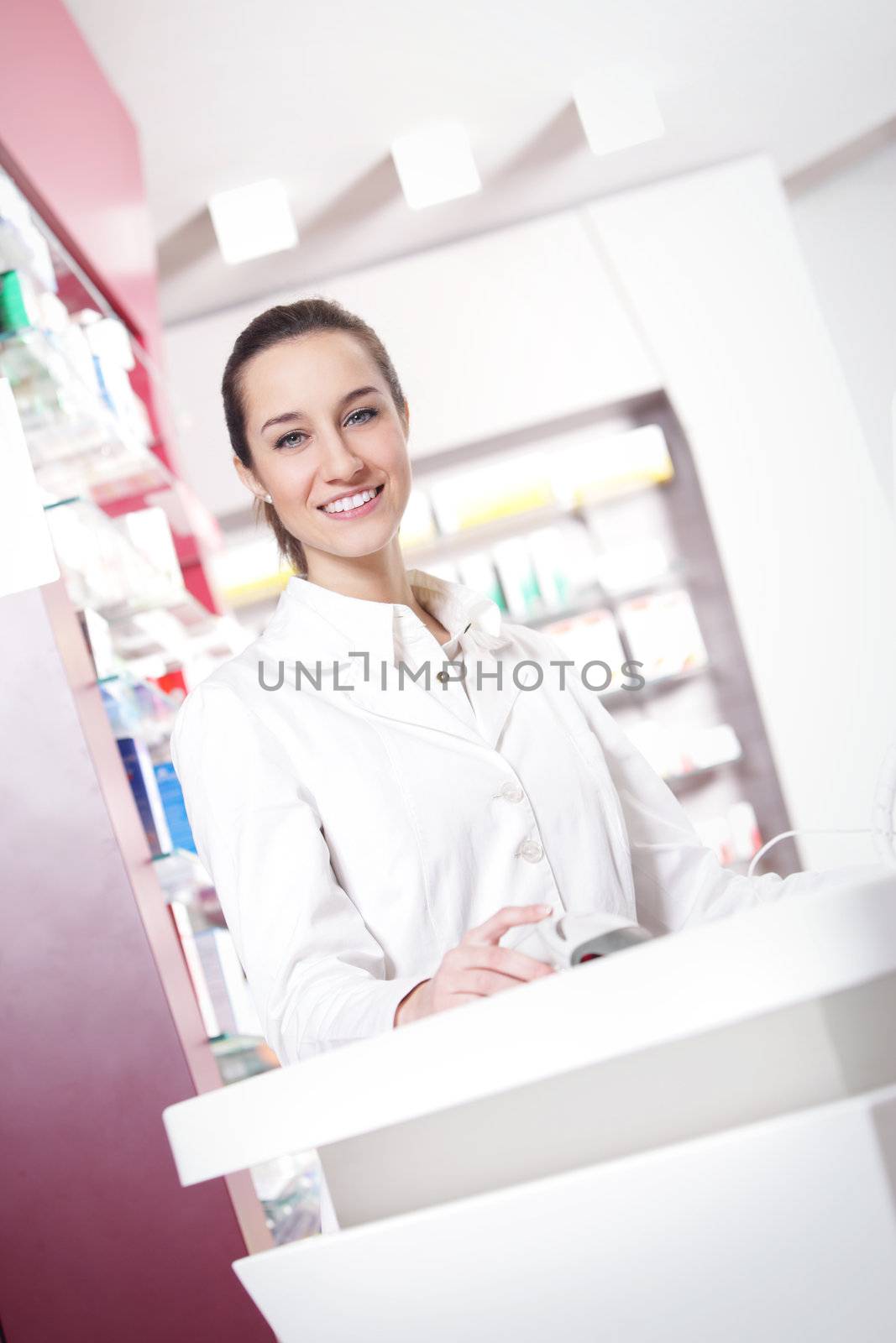 portrait of a female pharmacist at pharmacy