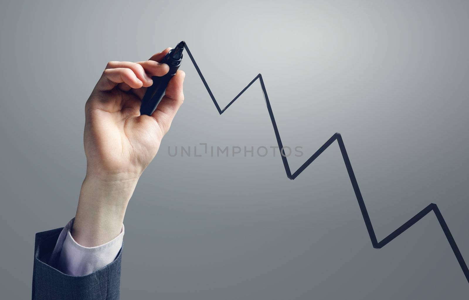 Businessman drawing a uptrend chart on screen