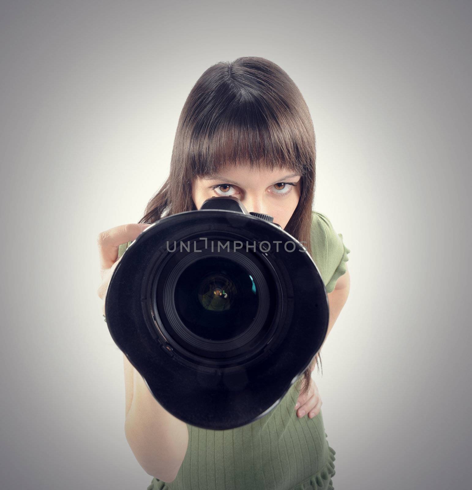 Woman taking a photo with a digital  camera 