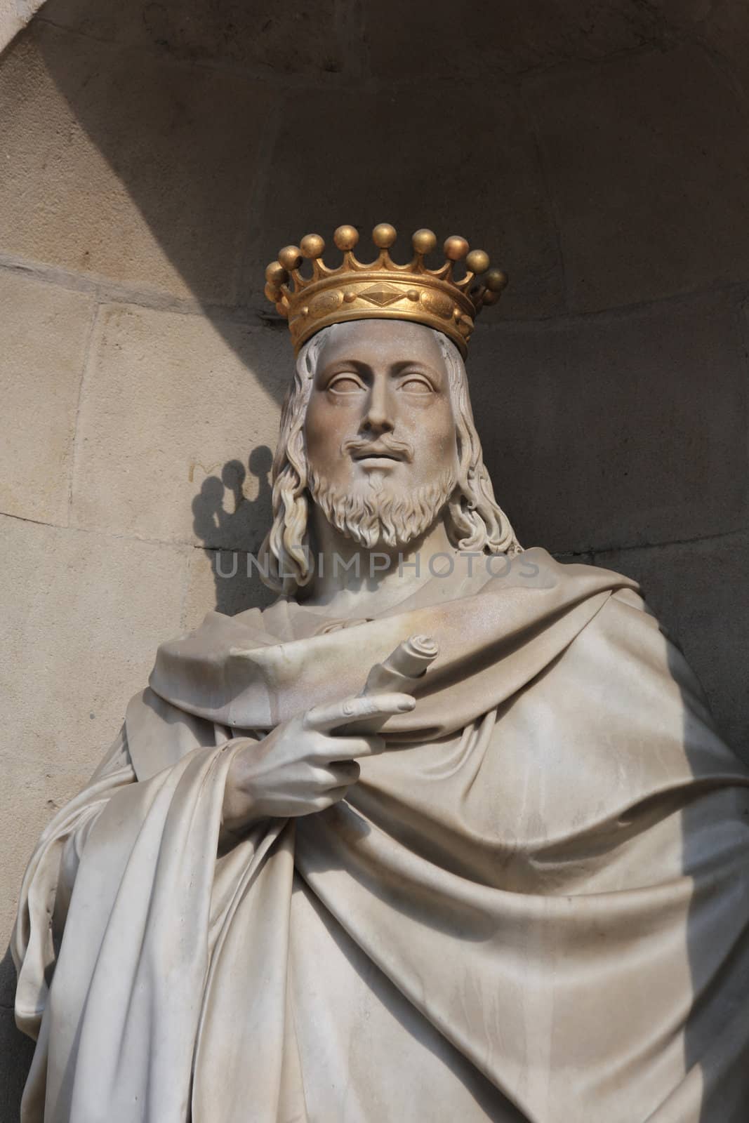 Statue with golden crown at plaza de la constitucion barcelona