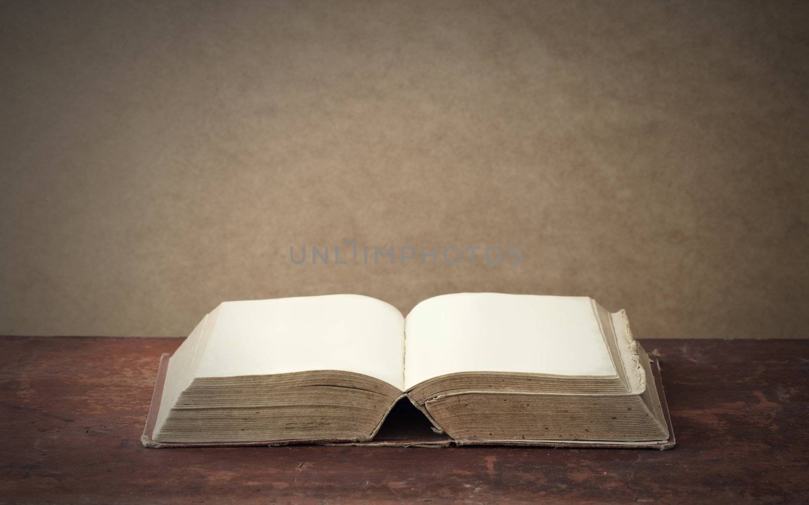 old book on wooden table