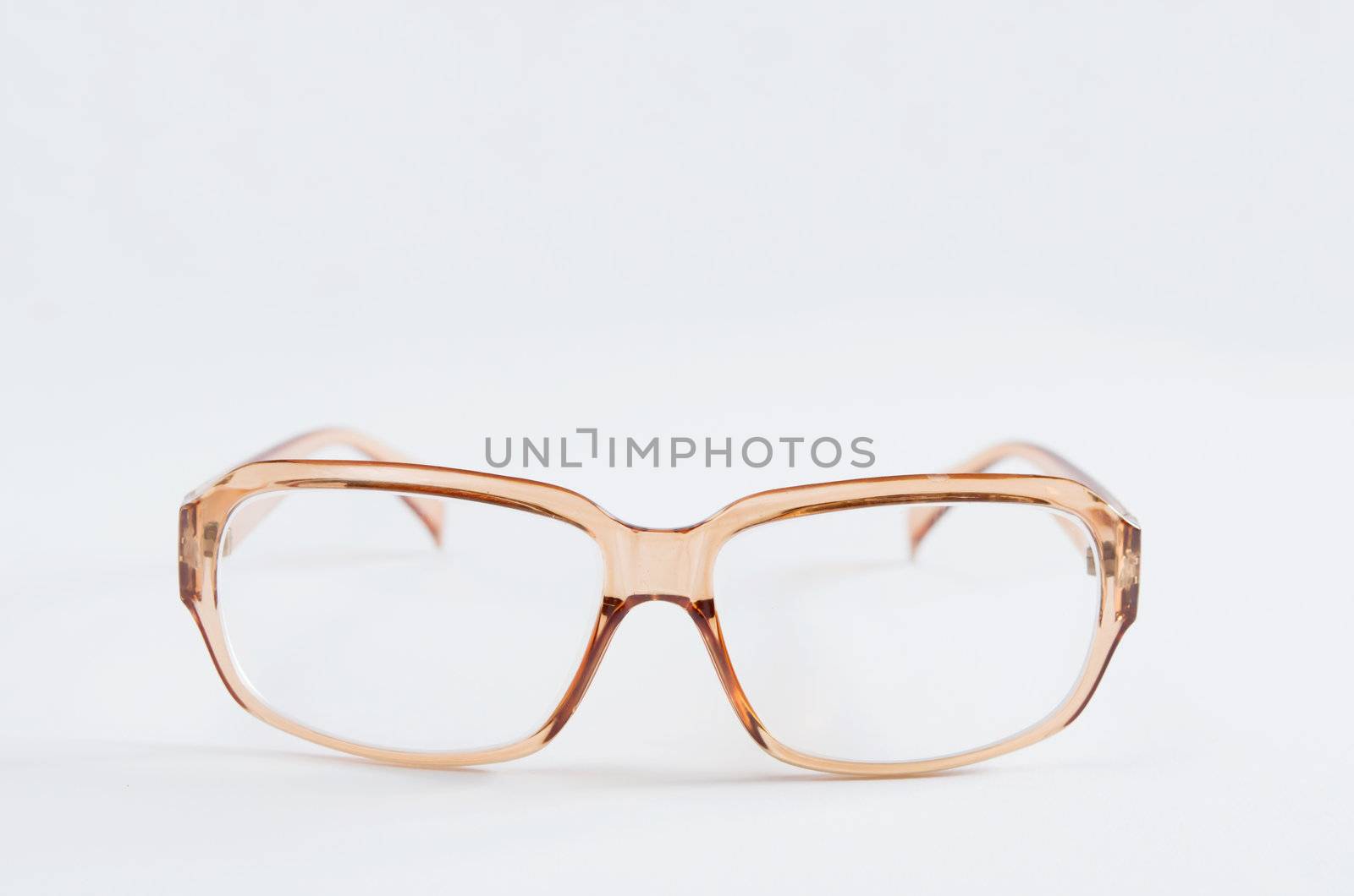 Photo of baby brown  eyeglasses  on white background
