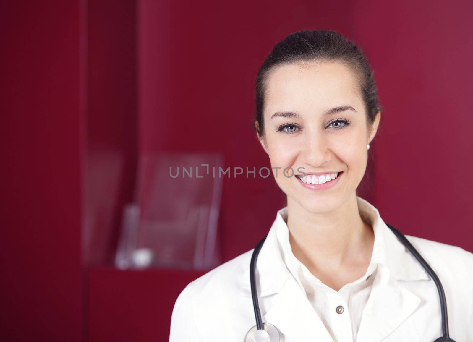 portrait of a female pharmacist at pharmacy by stokkete