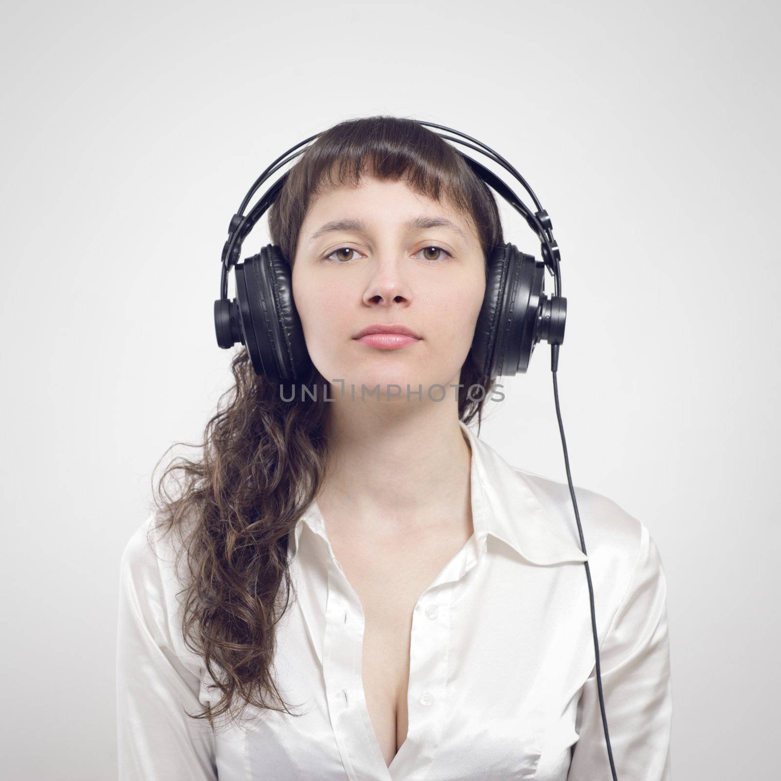 young woman listening to music with headphone