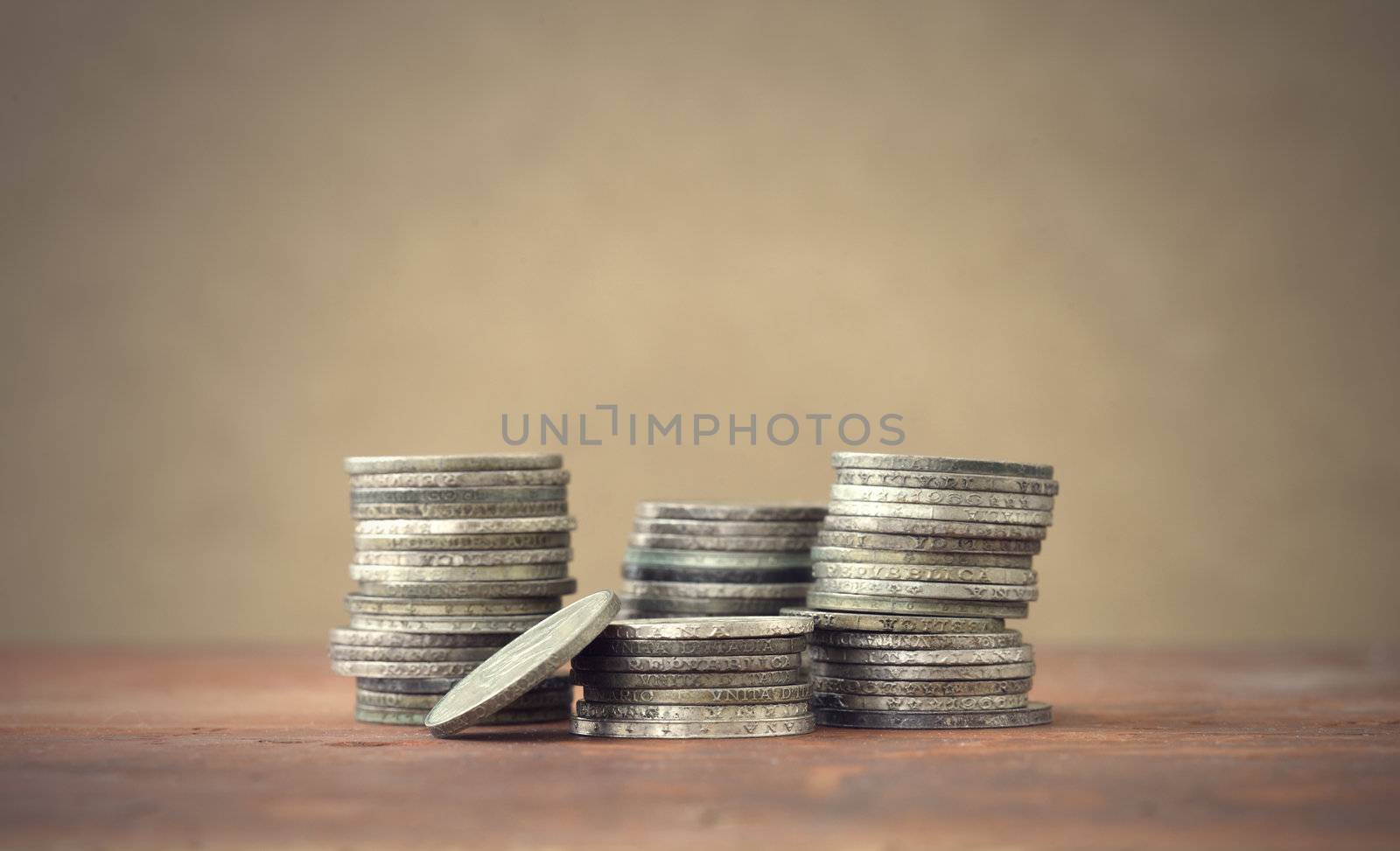 italian old coins on wooden table