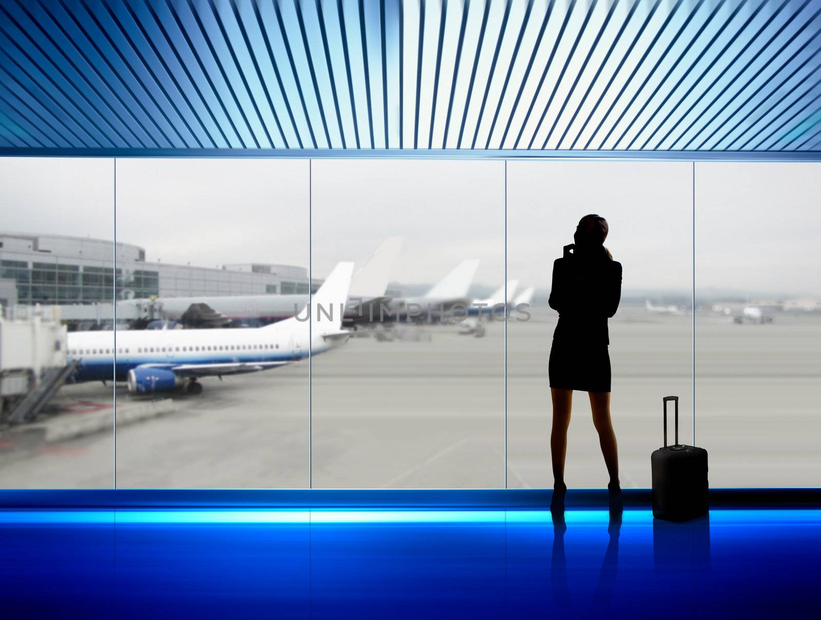 silhouette of businesswoman which expects flight aboard the plane in airport