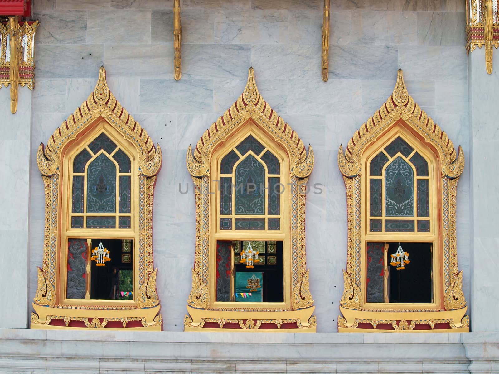 traditional Thai style windows in Benjamaborphit temple by jakgree