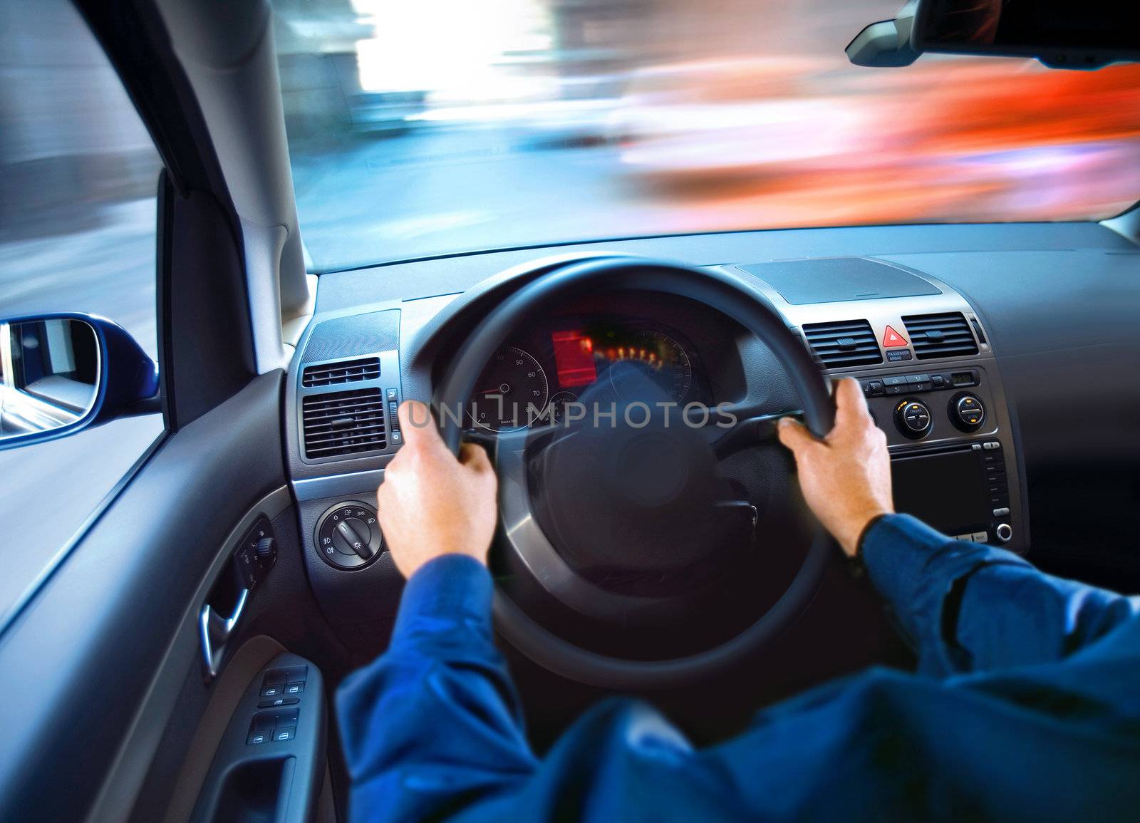 hands of driver that sits on driver's seat and turning wheel