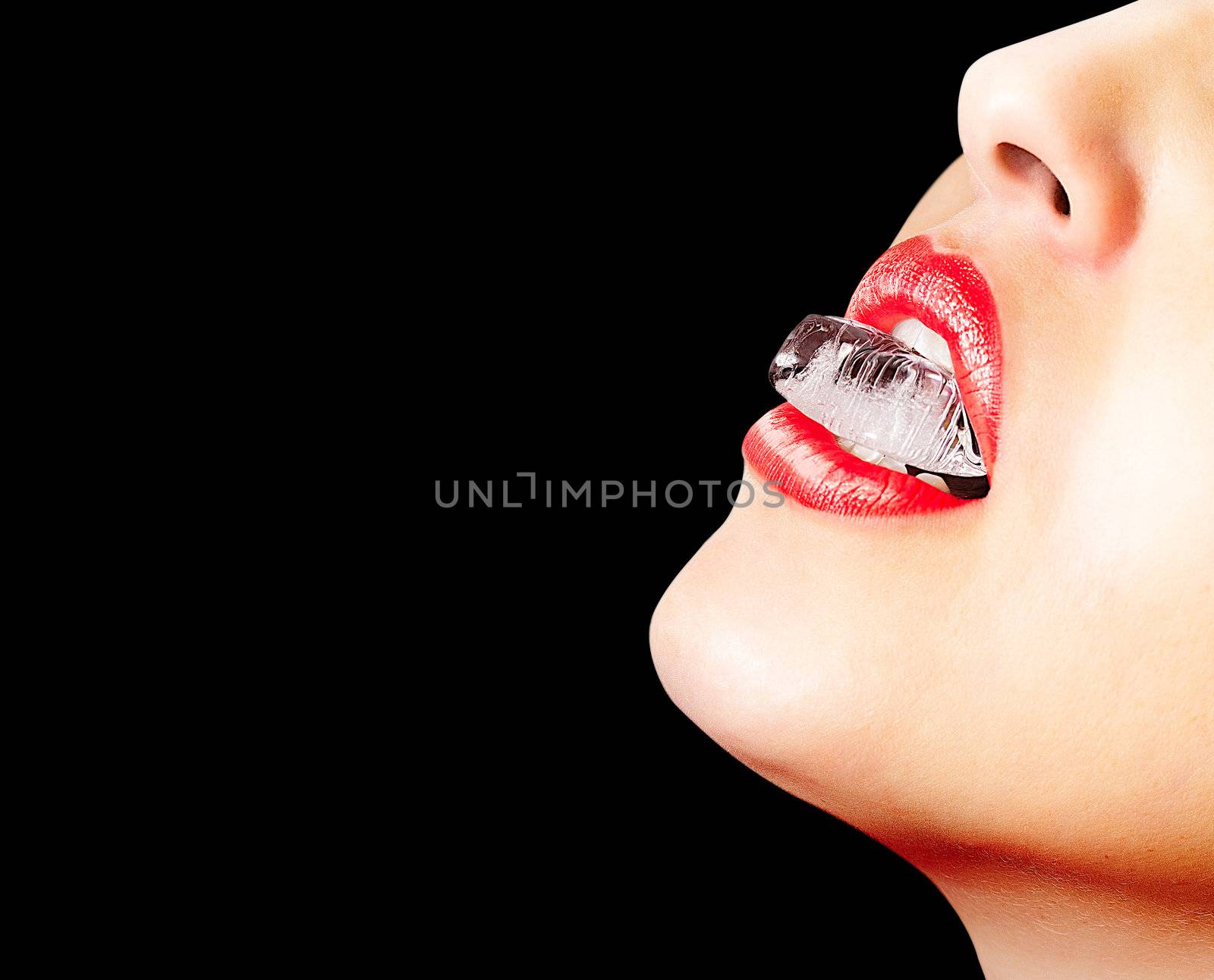 Closeup of sensual lips with red lipstick and an ice cube